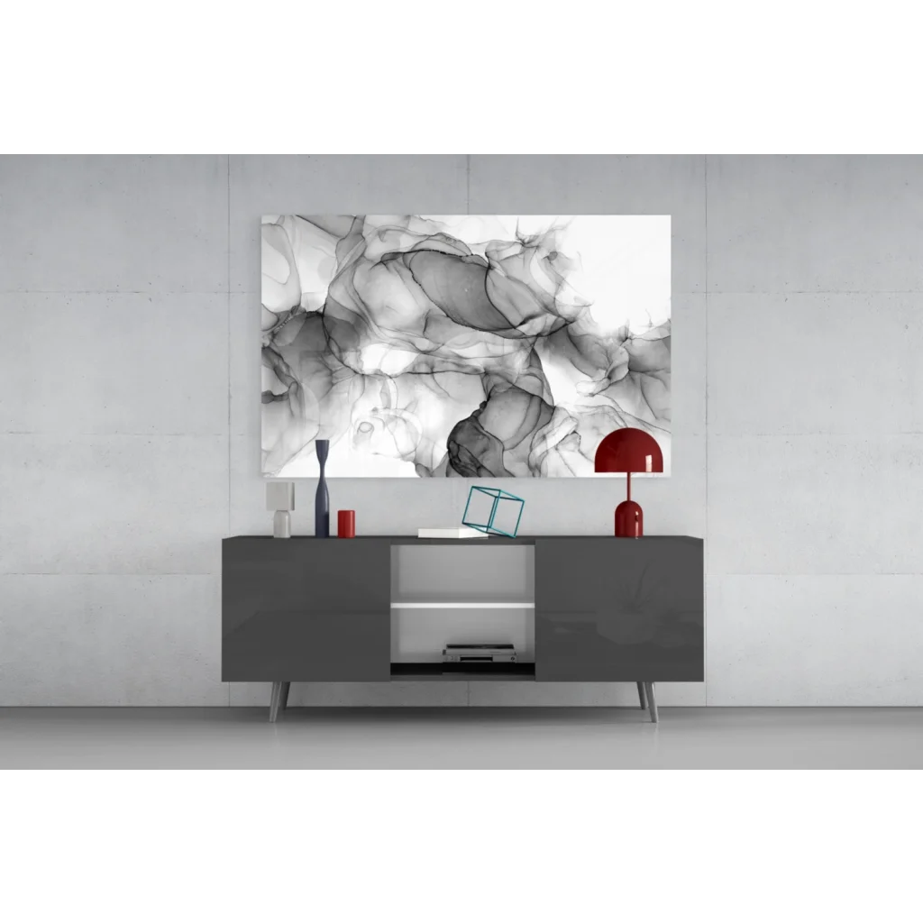 Abstract black and white inkblot wall art above gray console