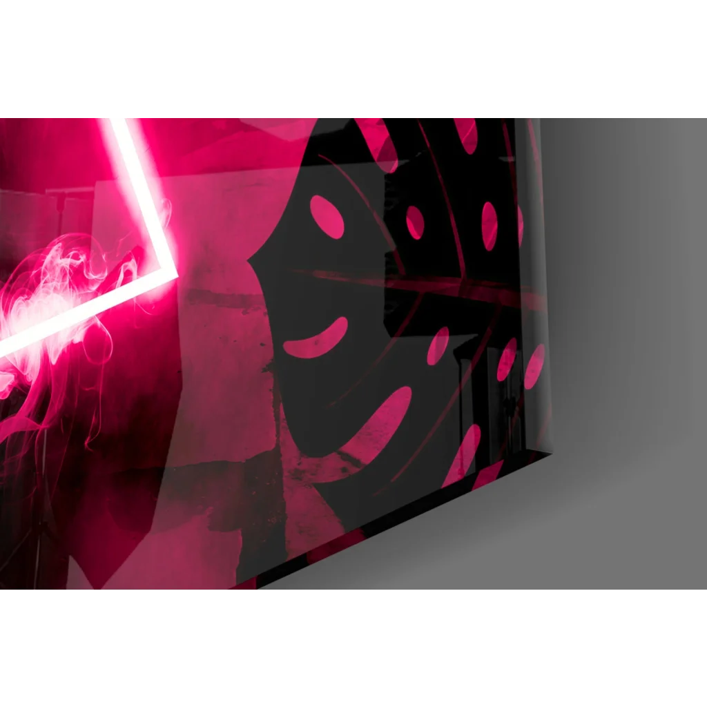 Glossy black glass wall art with smiling pink polka dot face and red neon glow