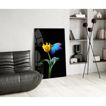 Vibrant yellow tulip with blue butterfly in stunning glass wall art