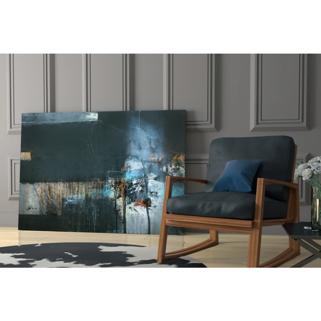 Bold abstract canvas wall art with metallic gold accents and gray upholstered chair