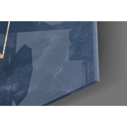 Translucent blue glass wall art with gold accents on navy textured canvas
