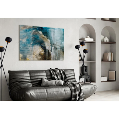 Gray leather sofa with tufted cushions and plaid throw under bold teal abstract wall art