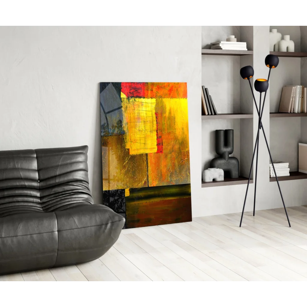 Vibrant glass wall art with bold yellow, orange, red geometric blocks on dark canvas