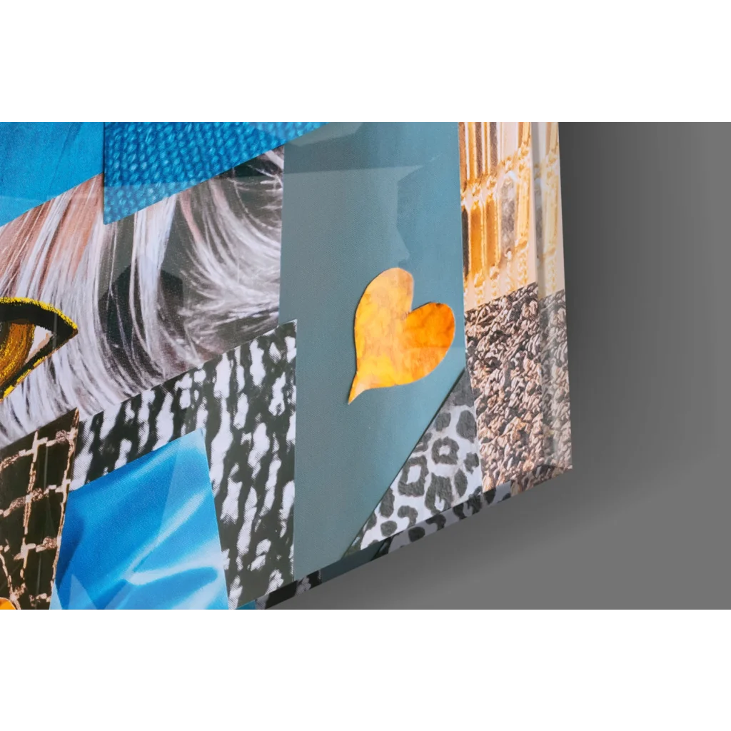 Vibrant patchwork glass wall art with bold eyes, textures, and orange heart