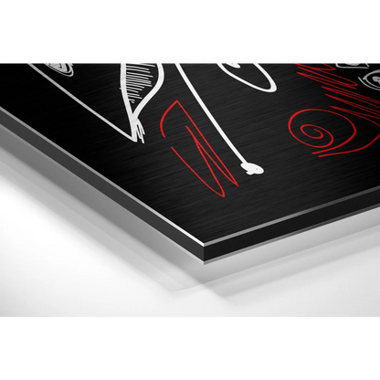 Bold red white abstract faces in black metal frame on brushed aluminium dibond
