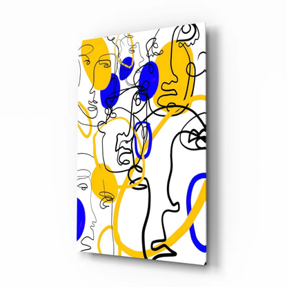 Bold abstract faces wall art in yellow and blue on white background
