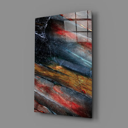 Fiery abstract glass wall art with swirling marbled blues, reds, and golds
