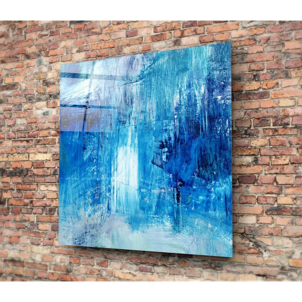 Bold blue brushstroke wall art canvas with textured hues on brick
