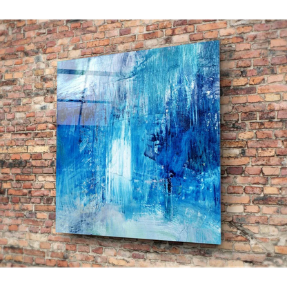 Bold blue brushstroke wall art canvas with textured hues on brick