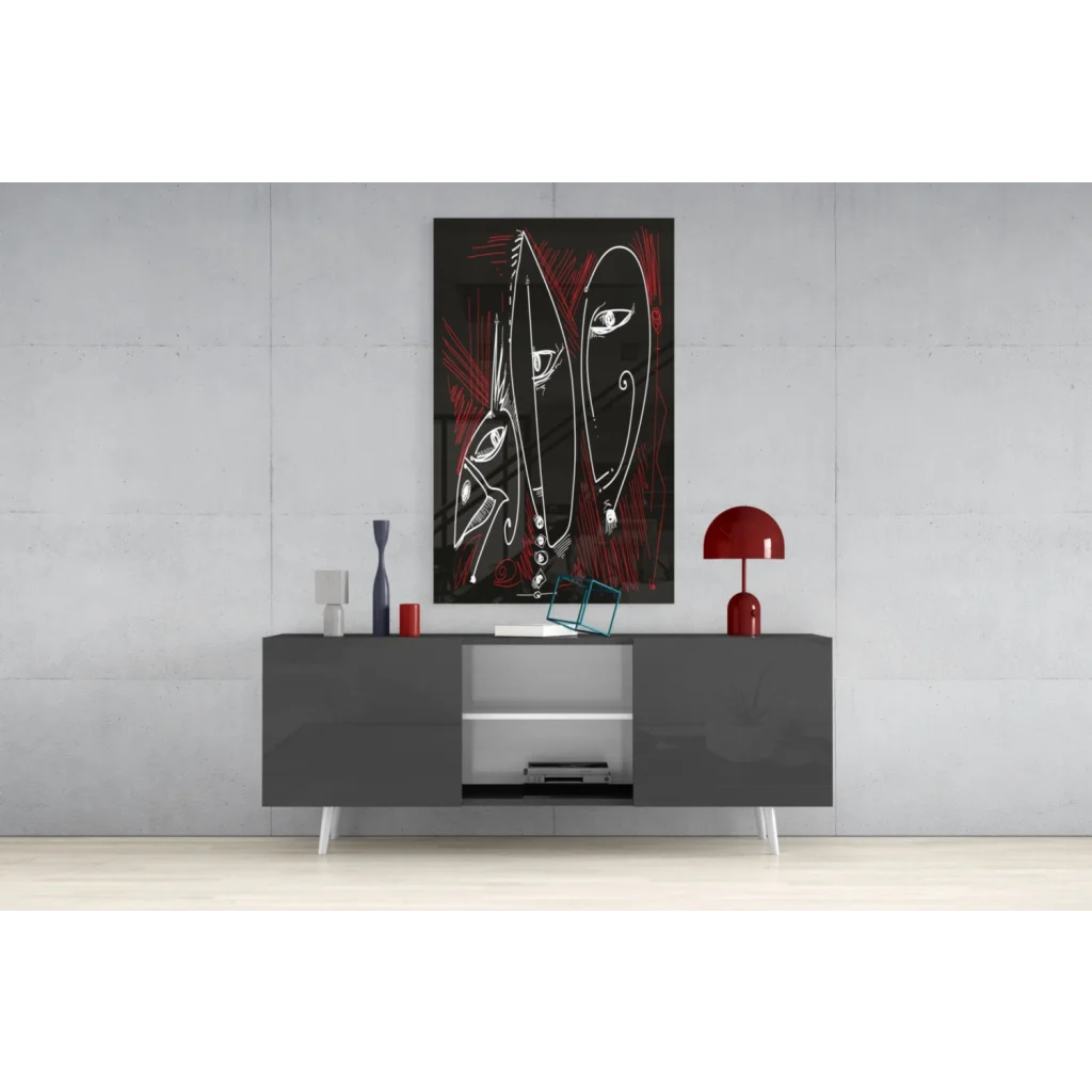 Bold red and black glass wall art with abstract faces