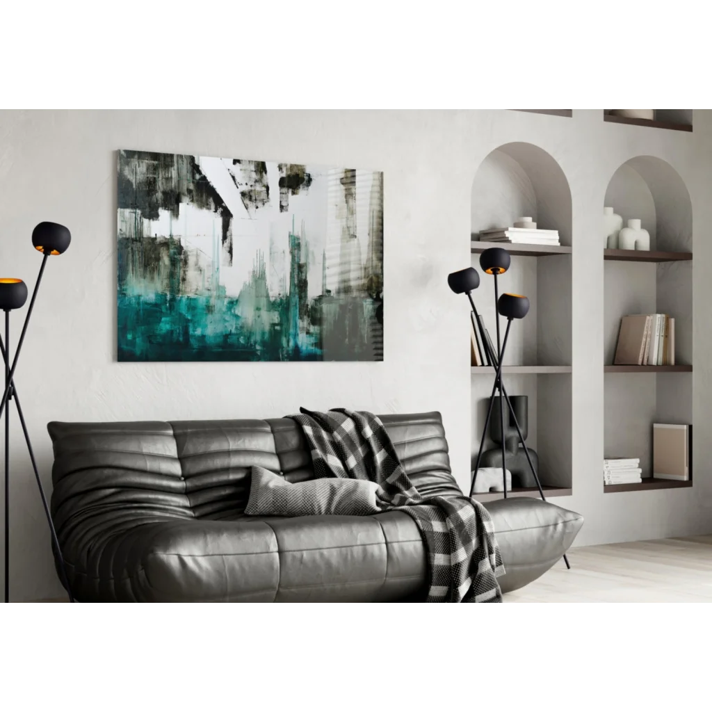 Gray ribbed leather sofa with checkered blanket under bold teal black wall art