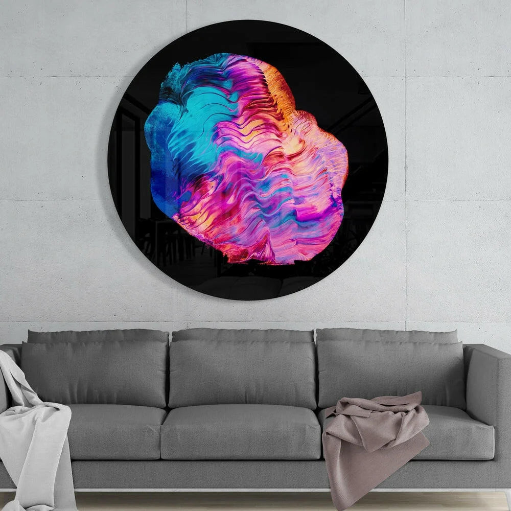 Vibrant tempered glass art with swirling blue, pink, orange hues on black circle