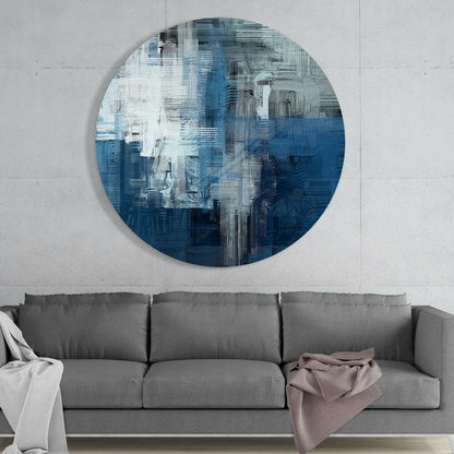 Stunning blue wave tempered glass art on concrete wall above gray sofa