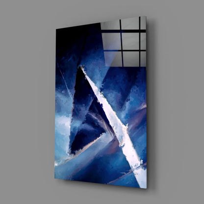 Abstract blue geometric wall art on gray wall