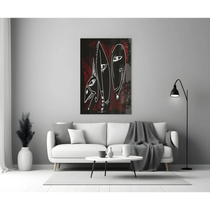 Bold red and black glass wall art with abstract faces