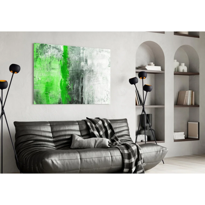 Black leather sofa with ribbed texture and plaid throw, near green abstract wall art