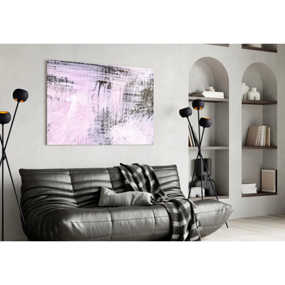 Modern abstract pink and black wall art above gray sofa