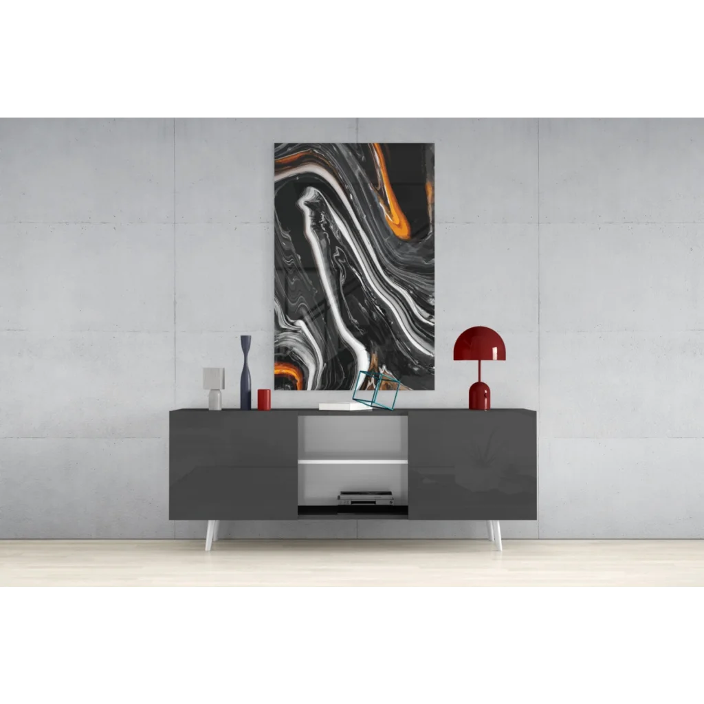 Swirling orange marble abstract wall art canvas with black white patterns above gray console