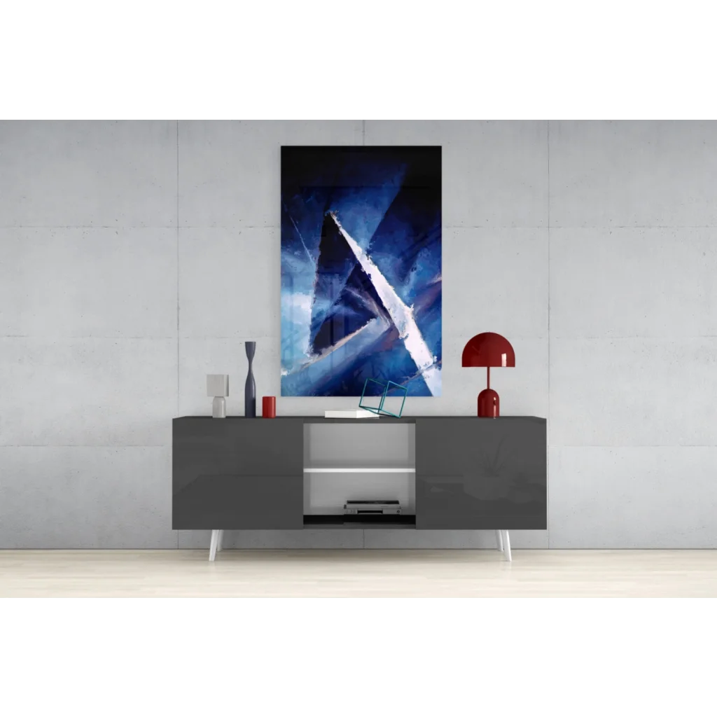 Bold blue geometric canvas wall art above modern gray console