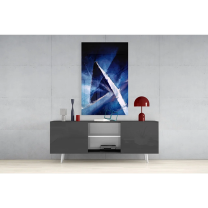 Bold blue geometric canvas wall art above modern gray console