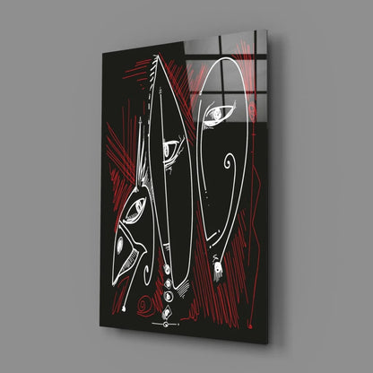 Bold red and black glass wall art with abstract white line faces
