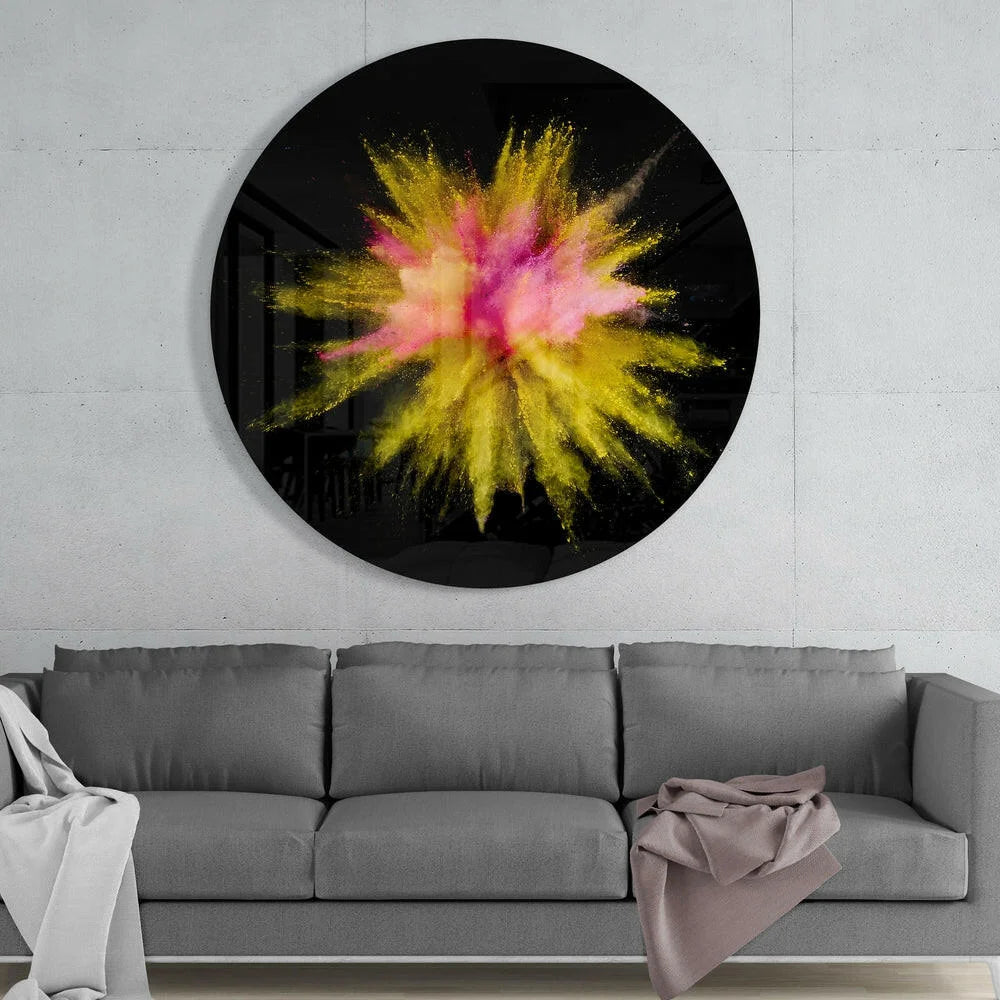 Vibrant pink yellow powder explosion on black tempered glass art circle