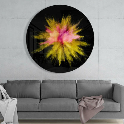 Vibrant pink yellow powder explosion on black tempered glass art circle