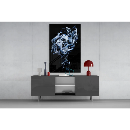 Abstract black and white swirling glass wall art above gray console