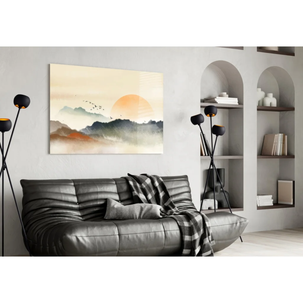 Modern black leather sofa with gray plaid throw on Sunset Mountains glass wall art