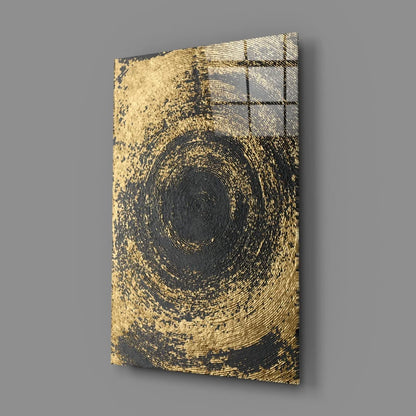Stunning gold and black swirl glass wall art with concentric patterns