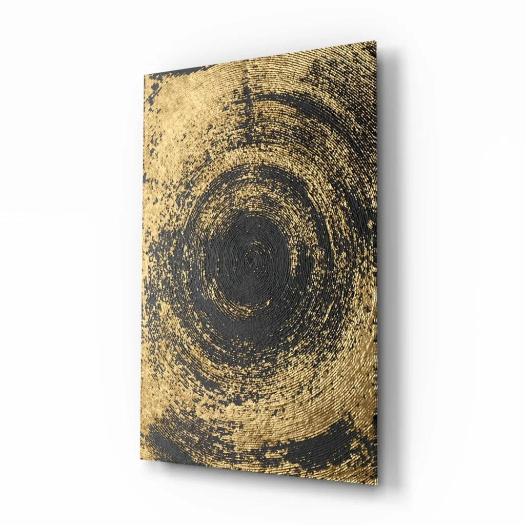 Black and gold swirl glass wall art with concentric patterns