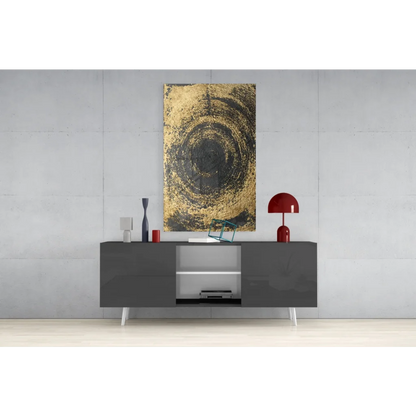 Stunning gold and black swirl glass wall art above gray console