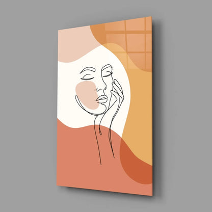 Cream-colored minimalist wall art with abstract orange face shapes