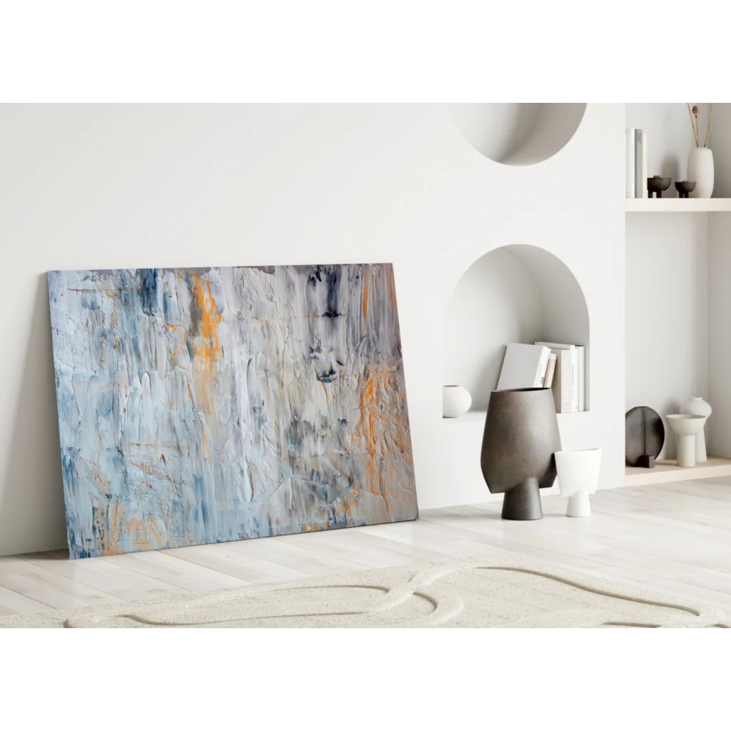 Textured abstract canvas wall art in muted blues, grays, orange accents
