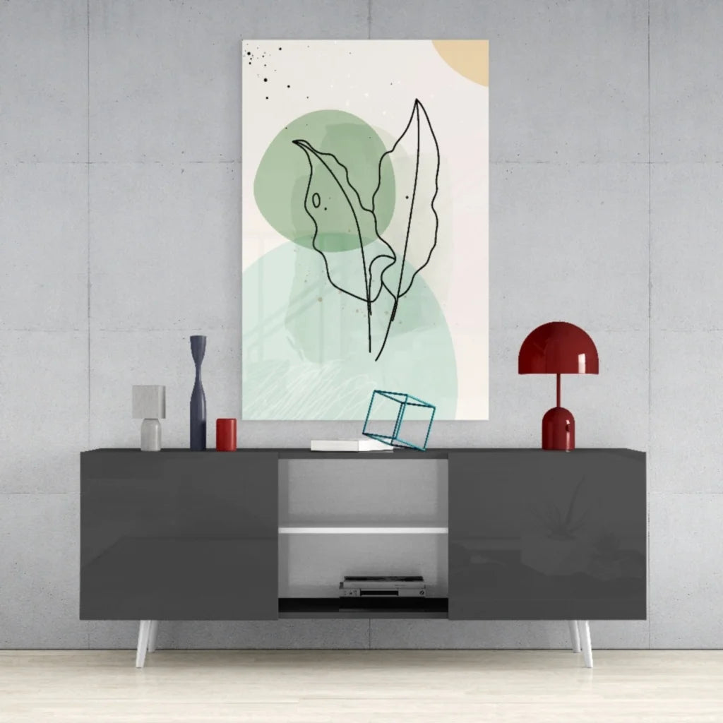 Minimalist glass wall art of black line leaves on green cream background