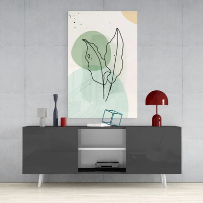 Minimalist glass wall art of black line leaves on green cream background
