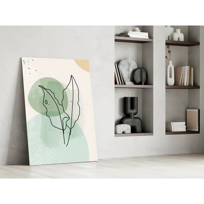Minimalist glass wall art with abstract black leaf outlines on mint green background