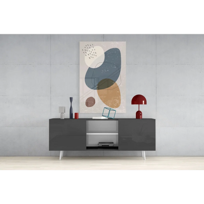 Stunning glass wall art with abstract geometric overlapping circles in muted blue, beige, and brown tones