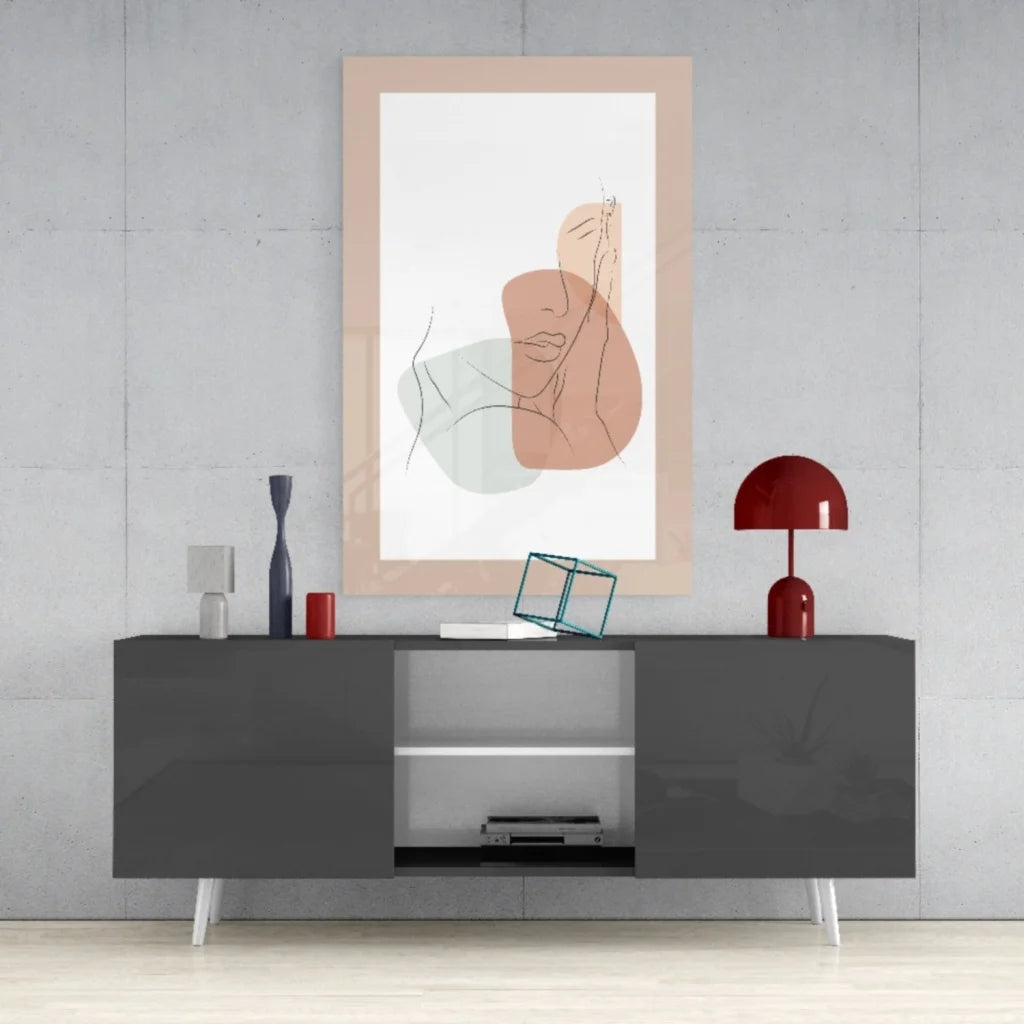 Peach and green abstract face wall art print in soft peach frame