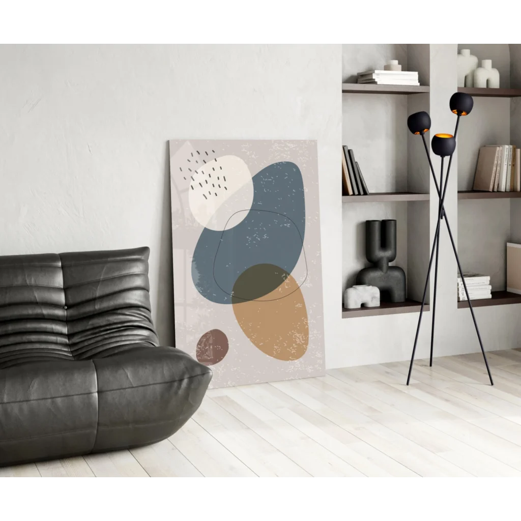 Modern glass wall art with abstract muted blue, beige, brown shapes on textured off-white
