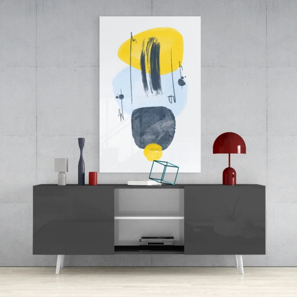 Bold abstract glass wall art with yellow, black, and blue brushstrokes