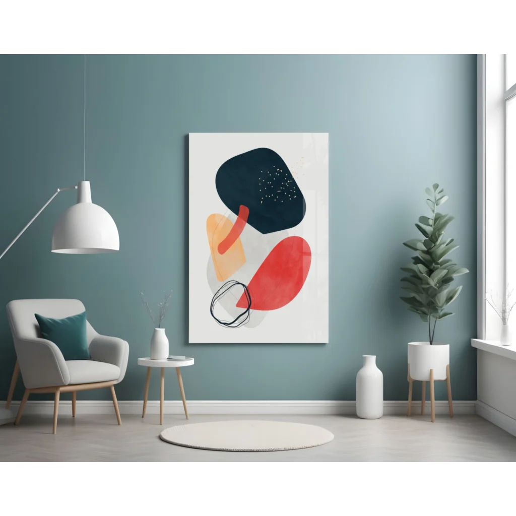 Bold abstract glass wall art with vibrant black, red, orange shapes on white