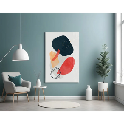 Bold abstract glass wall art with vibrant black, red, orange shapes on white