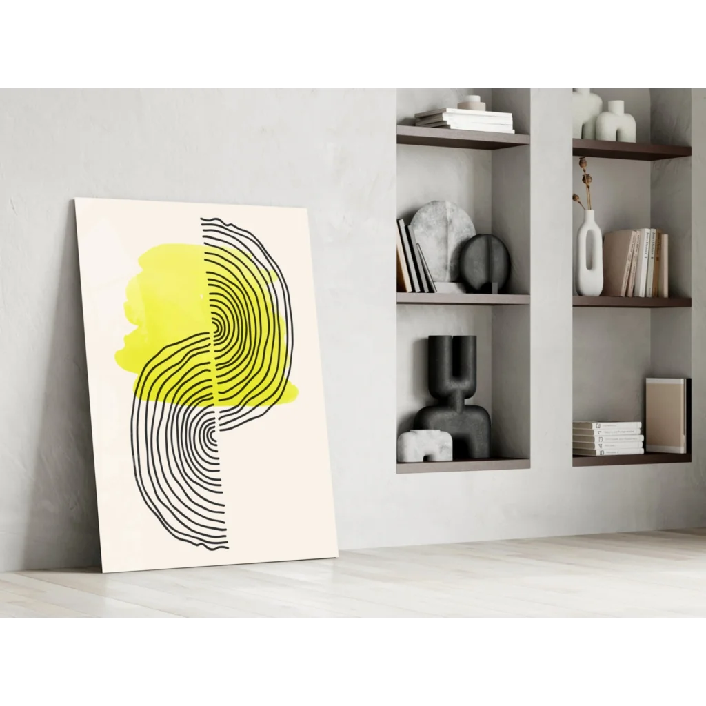 Modern glass wall art with bold black concentric lines and yellow splotch