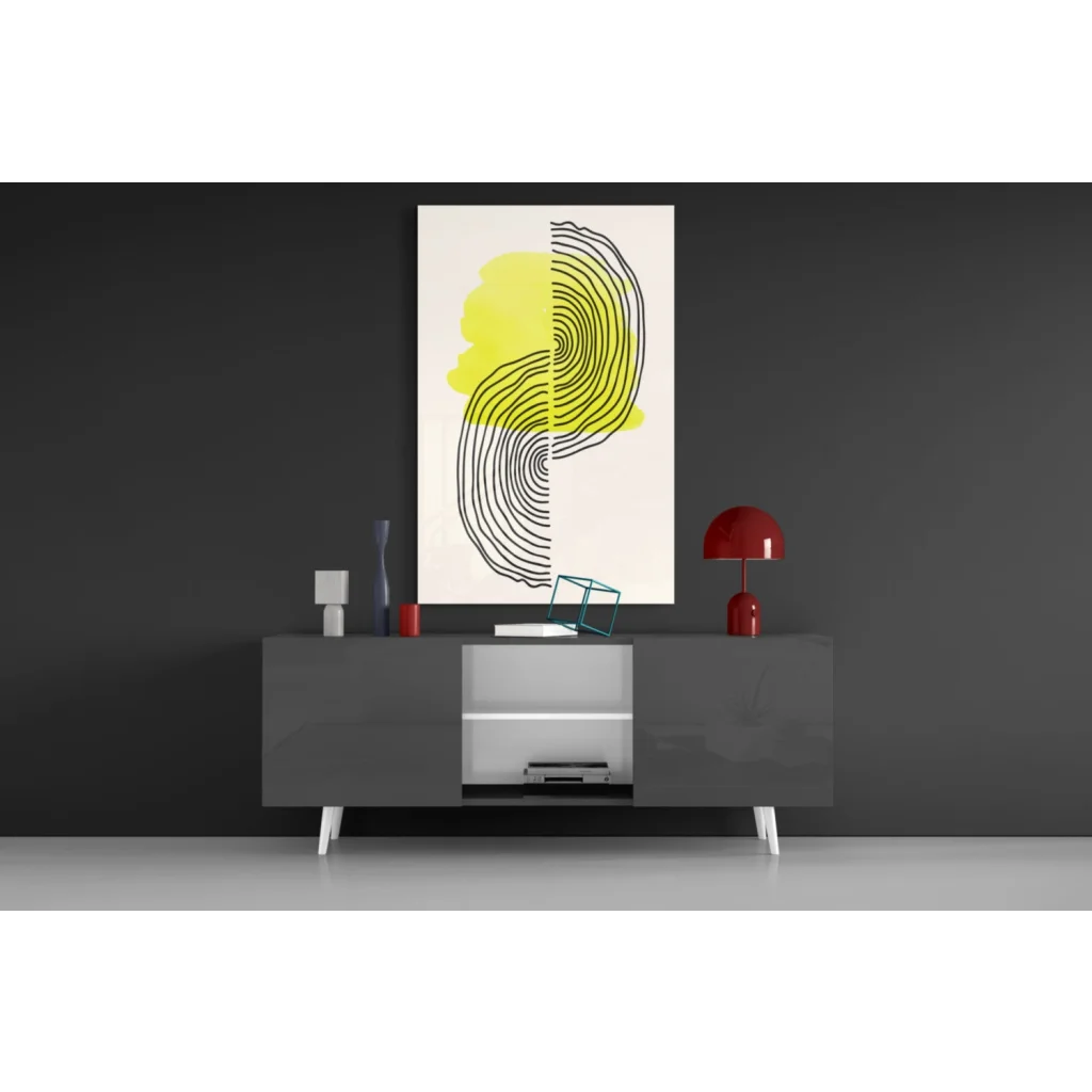 Stunning glass wall art with bold yellow and black concentric circles on white background
