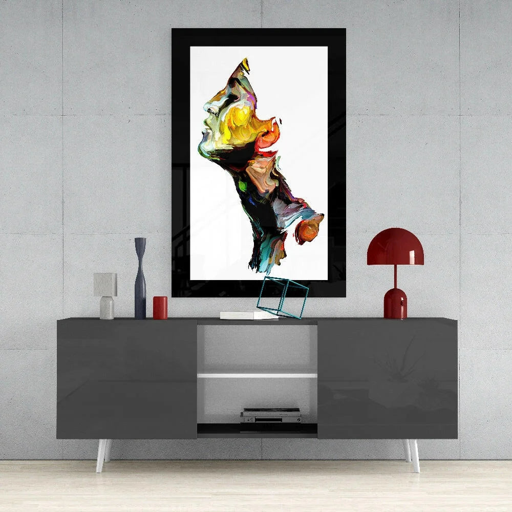 Vibrant abstract face glass wall art in bold swirling yellow, orange, green, blue