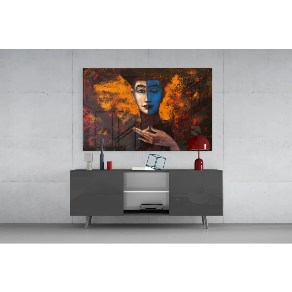 Abstract glass wall art of split-hue face in blue and orange