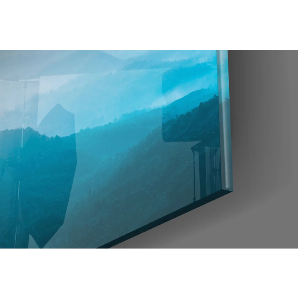 Sleek glass wall art of serene blue mountain sunset on TV screen
