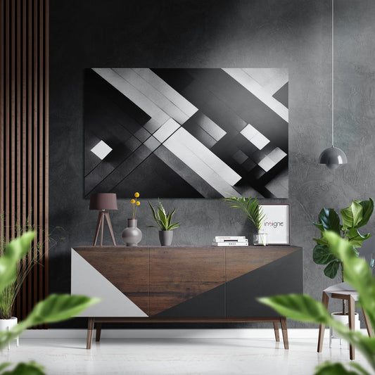 Modern living room with abstract black, white, and gray geometric aluminum wall art displayed above a wood and white credenza with potted plants and accessories.