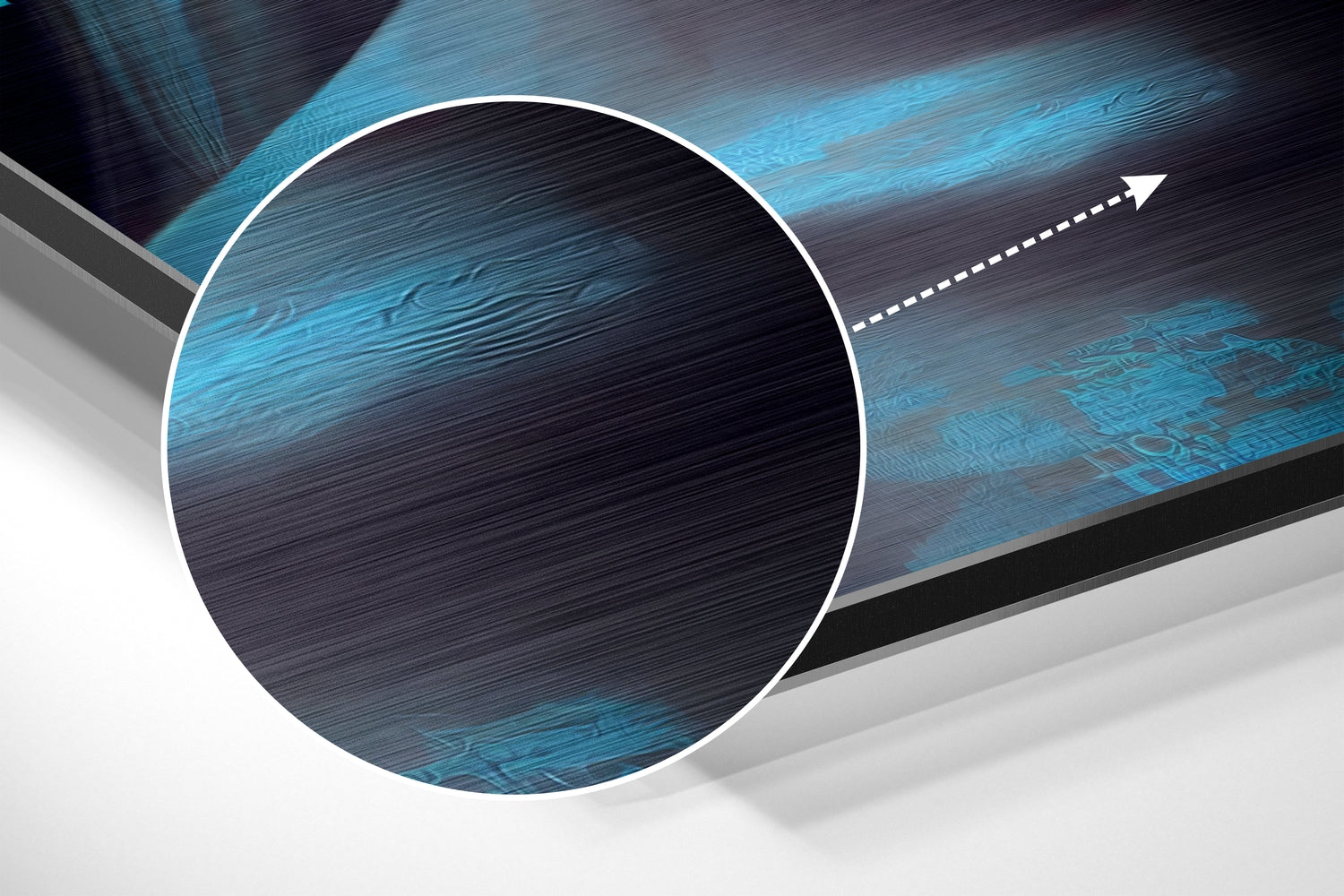 Abstract composition featuring a white-bordered circle with brushed blue and black textured aluminum surface and directional arrow graphic.